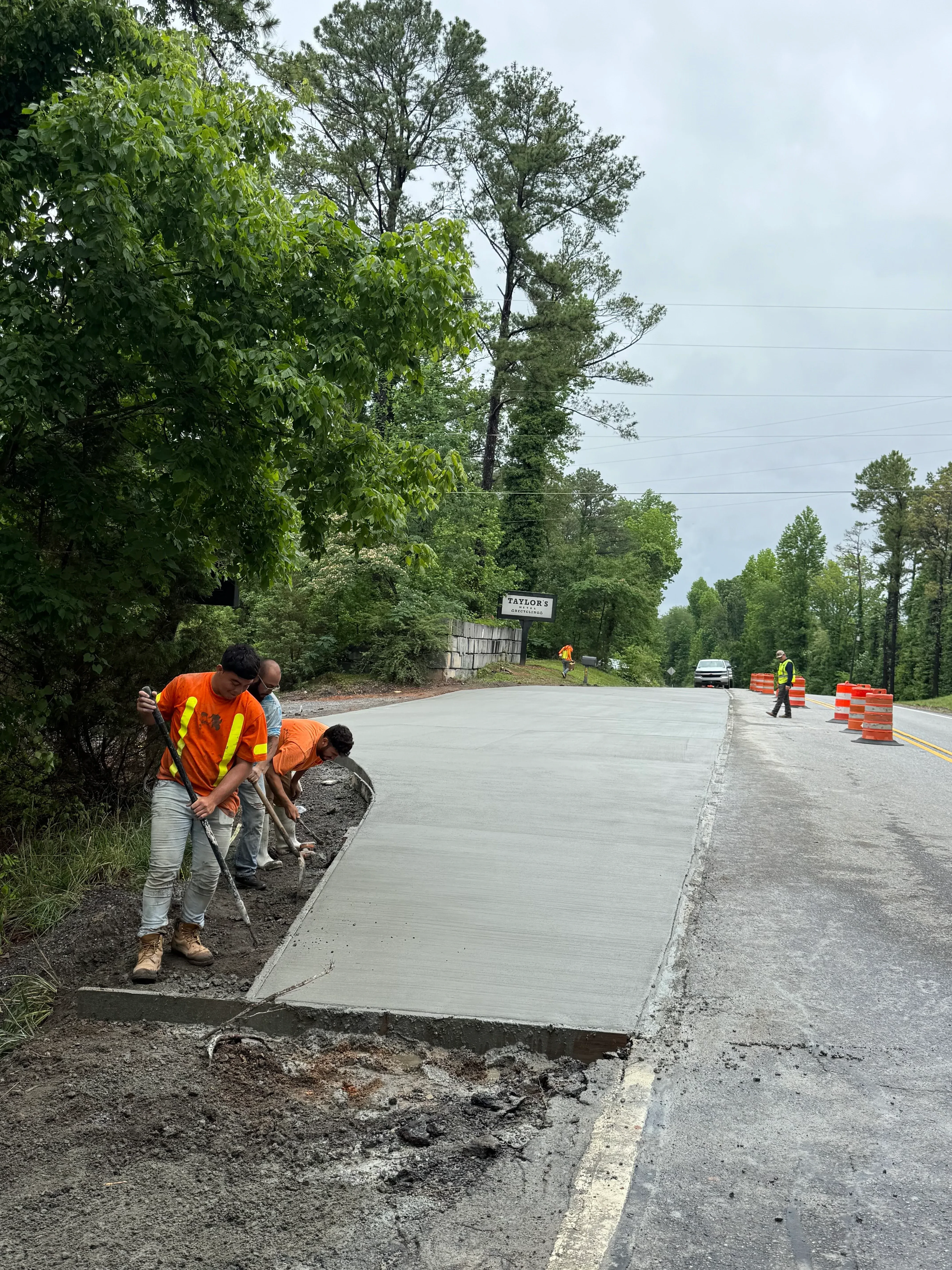Concrete driveway repair with new poured concrete sections and formed edges